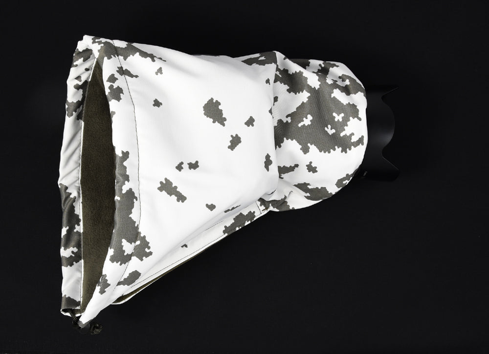 Waterproof and insulated camera covers, camera protection and Realtree camera camouflage, camera rain covers, dust and snow covers. Our 'Four Season' camera covers reduce battery drain & shutter sound. We first designed our heated camera covers for use by the British forces. The cover has four layers of technical fabrics including a fleece lining with a heat pack pocket, ideal for nature photography, wildlife photography and outdoor photography protecting your outdoor photography gear and long lenses.