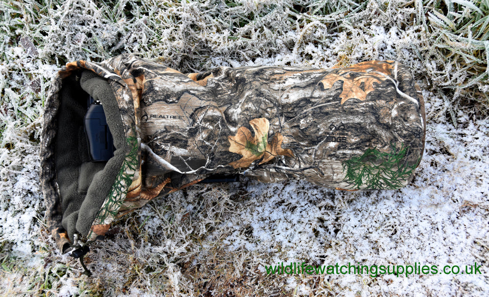 Waterproof and insulated camera covers, camera protection and Realtree camera camouflage, camera rain covers, dust and snow covers. Our 'Four Season' camera covers reduce battery drain & shutter sound. We first designed our heated camera covers for use by the British forces. The cover has four layers of technical fabrics including a fleece lining with a heat pack pocket, ideal for nature photography, wildlife photography and outdoor photography protecting your outdoor photography gear and long lenses.