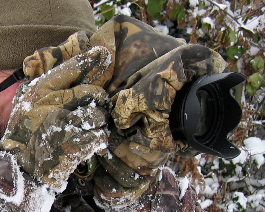 Waterproof and insulated camera covers, camera protection and Realtree camera camouflage, camera rain covers, dust and snow covers. Our 'Four Season' camera covers reduce battery drain & shutter sound. We first designed our heated camera covers for use by the British forces. The cover has four layers of technical fabrics including a fleece lining with a heat pack pocket, ideal for nature photography, wildlife photography and outdoor photography protecting your outdoor photography gear and long lenses.