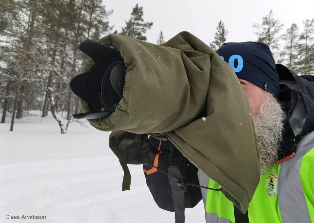 Our Four Seasons cover in use recording sled racing. Our insulated covers keep you going by reducing battery drain